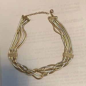 An adjustable gold and silver necklace